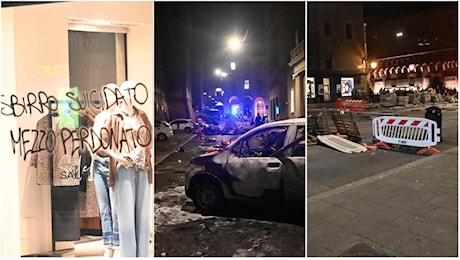 Bologna ‘devastata’ dopo il presidio per Fakir: auto a fuoco, vetrine spaccate, scritte violente contro la polizia